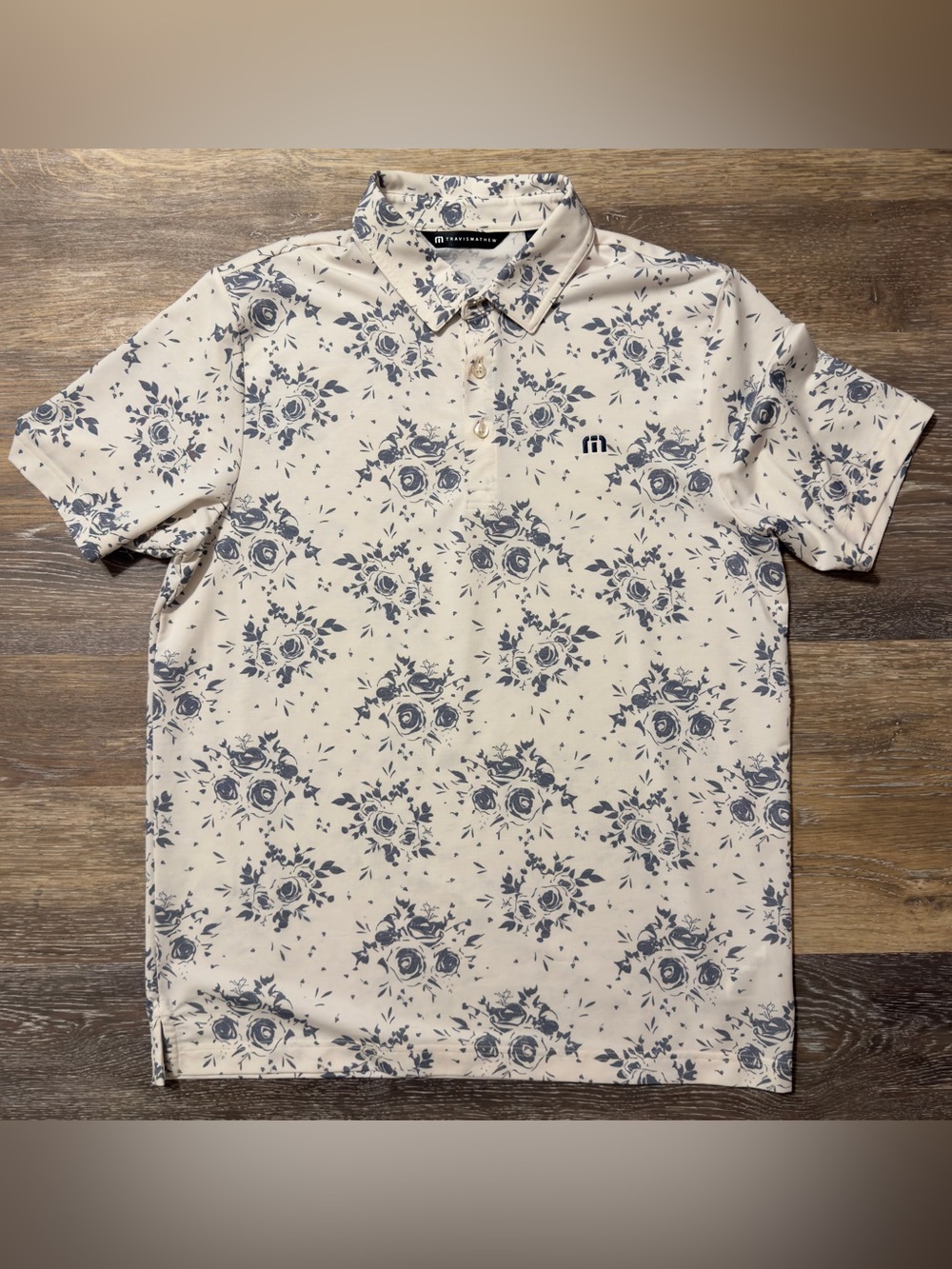 TravisMathew Cream Polo with Blue Floral Print